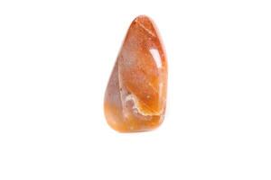 Macro mineral stone Carnelian on white background photo