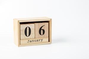 Wooden calendar January 06 on a white background photo