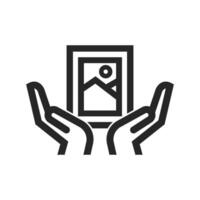 Hand holding painting icon in thick outline style. Black and white monochrome vector illustration.