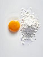 AI generated One egg yolk left and white flour right on the white background. High-resolution. AI Generative photo