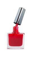 open bottle of red nail polish isolated on a white background photo