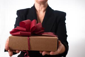 Unrecognizable mature caucasian woman recieving a present photo