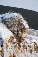 rock stone snow. View from the top to the cliffs. Russia's nature. first snow, river white snow, morning, height. beauty, wildlife photo