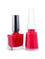 two bottles of red nail polish isolated on a white background photo