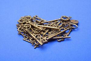 Old, vintage keys in the shape of a heart photo