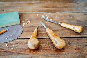 tools for wood carving. a set of chisels lies on the table photo