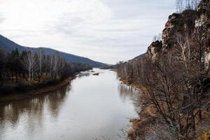 a river between rocks and forests photo