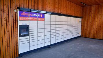 Warsaw, Poland. 16 February 2024. Sign Allegro Smart. Company signboard Allegro Smart. Allegro Smart parcel locker. photo