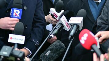 Warsaw, Poland. 7 February 2024. Microphones with the logo of the TV news  channels. photo