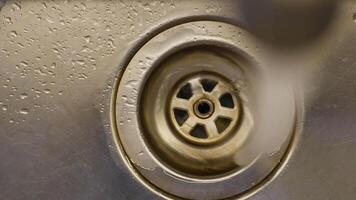 water pouring from a faucet tap slow motion video