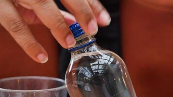 open a cap of a plastic water bottle video