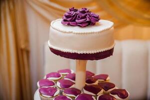 Wedding cake on a stand. Wedding preparations. Wedding Attributes photo