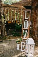Wedding arch and decorations for rustic wedding ceremony. photo
