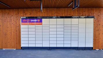 Warsaw, Poland. 16 February 2024. Sign Allegro Smart. Company signboard Allegro Smart. Allegro Smart parcel locker. photo