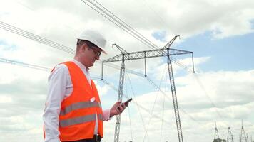 Engineer working near transmission lines. Energy efficiency conception video