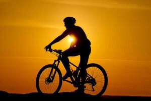 Cyclist on background of sunset, sport and travel concept photo