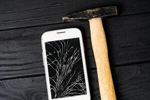Modern broken mobile phone. Smartphone with broken screen photo