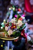 Beautiful floral bouquet with blossom flowers for bride on the blurred background. Bunch of fragrant tendy flowers for wedding ceremony. Close-up photo