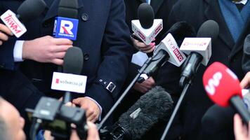 Warsaw, Poland. 7 February 2024. Microphones with the logo of the TV news  channels. photo