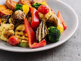 Various barbecue grilled vegetables on plate photo