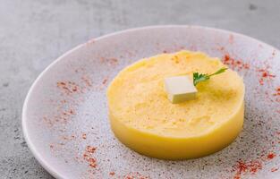 Mashed Potatoes with Butter on plate photo