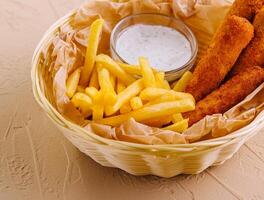 Fried chicken nuggets with french fries photo