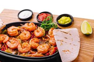 Shrimp fajitas with bell pepper and onion photo