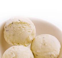 Pistachio ice cream scoops on a bowl photo