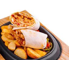 shawarma with fried potato wedges and different sauce photo