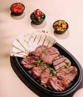Grilled meat steak veal medallions with pita photo