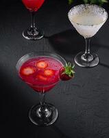 martini glasses of red and coconut alcohol drinks photo
