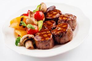 Medallions of veal with grilled vegetables photo