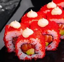 Macro shot of california maki sushi rolls with rice photo