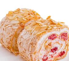 sponge cake roll with raspberries inside photo