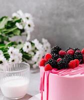 Pink cake with mascarpone cream and fresh berries photo