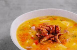 Italian soup with vegetables and bacon photo