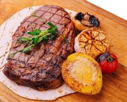 Grilled Tenderloin steak with vegetables photo