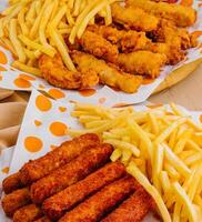 french fries with chicken nuggets close up photo