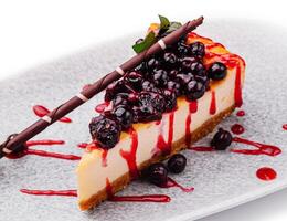 Classic New York style cheesecake with currant jam photo