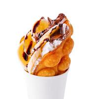 hong kong or bubble waffle with whipped cream, chocolate and bananas photo