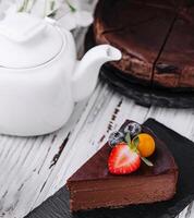 Dark chocolate cake and tea photo