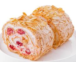 sponge cake roll with raspberries inside photo