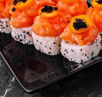 Maki Sushi - Roll topped with Sliced Spicy Salmon photo