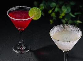 martini glasses of red and coconut alcohol drinks photo