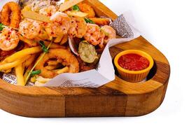 fried seafood plate on wooden tray photo