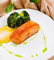 grilled salmon fillet steak with broccoli photo