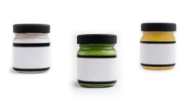different types of sauces in jars isolated photo