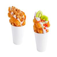 Bubble Waffle with kiwi, bubble tea, nuts and whipped cream photo