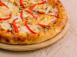 Delicious pizza with chicken, pepper and mushrooms photo