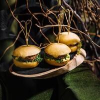 three mini burgers in the forest photo